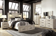 Ashley Furniture Cambeck bed with two storage drawers, featuring a sleek modern design and a warm wood finish.