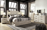 Ashley Furniture Cambeck bed with two storage drawers, featuring a sturdy frame and sleek design in the image.