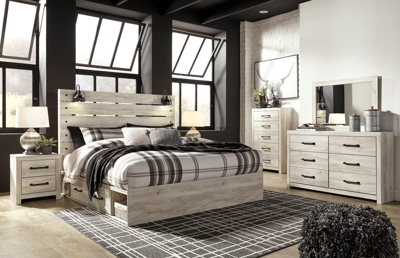 Ashley Furniture Cambeck bed with two storage drawers, featuring a sturdy frame and sleek design in the image.