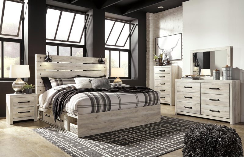Ashley Furniture Cambeck bed with four storage drawers in a modern wooden design, shown with a neutral-toned room setting