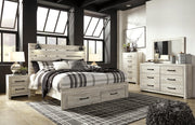 Ashley Furniture Cambeck bed with two built-in storage drawers, featuring a sturdy wooden frame and a classic design.