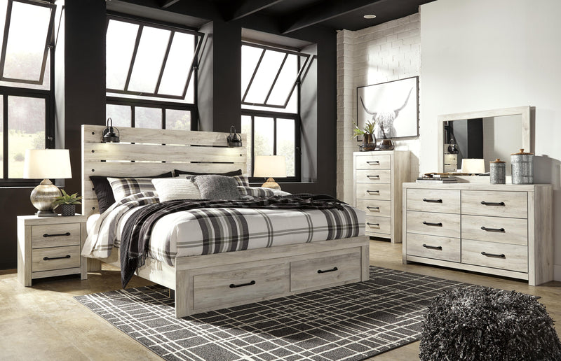 Ashley Furniture Cambeck bed with two built-in storage drawers, featuring a sturdy wooden frame and a classic design.