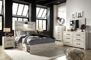 Ashley Furniture Cambeck youth bed with two storage drawers, featuring a sturdy frame and a sleek, modern design.