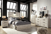 Ashley Furniture Cambeck Bed with four spacious storage drawers, featuring a sturdy frame and classic design.