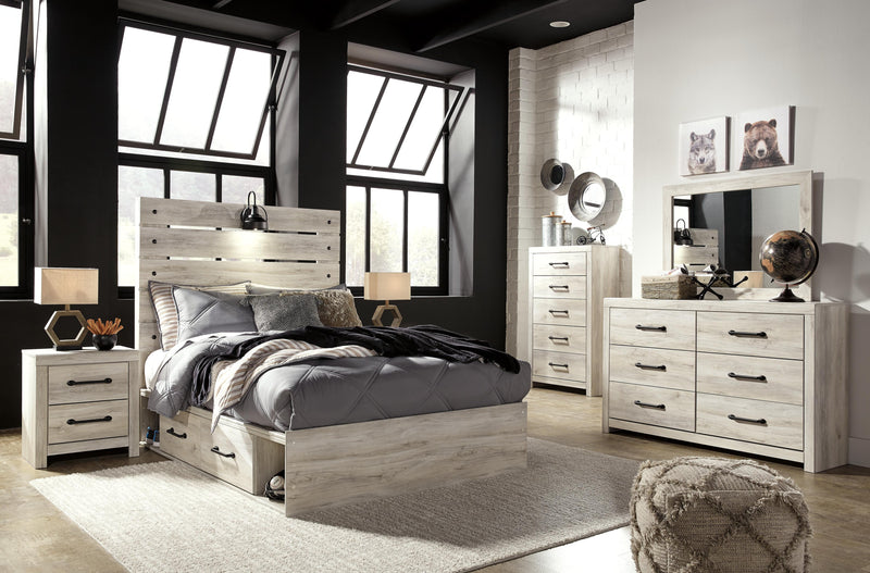 Ashley Furniture Cambeck Bed with four spacious storage drawers, featuring a sturdy frame and classic design.