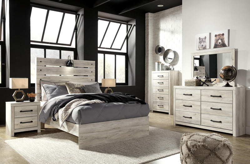 Ashley Furniture Cambeck Bed with dark wood finish and panel headboard, shown in a modern bedroom setting.