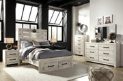 Ashley Furniture Cambeck bed with two storage drawers, featuring a modern wooden bed frame and built-in storage for bedroom organization.