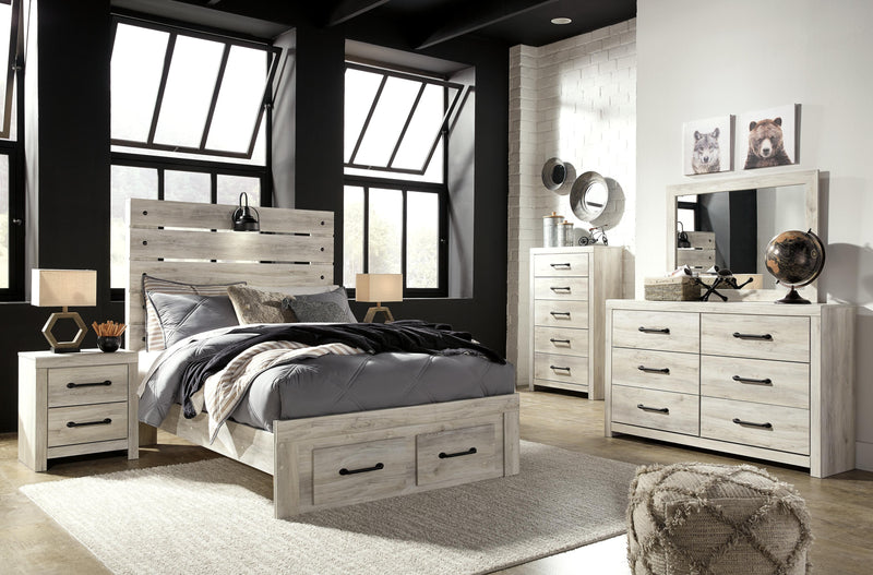 Ashley Furniture Cambeck bed with two storage drawers, featuring a modern wooden bed frame and built-in storage for bedroom organization.