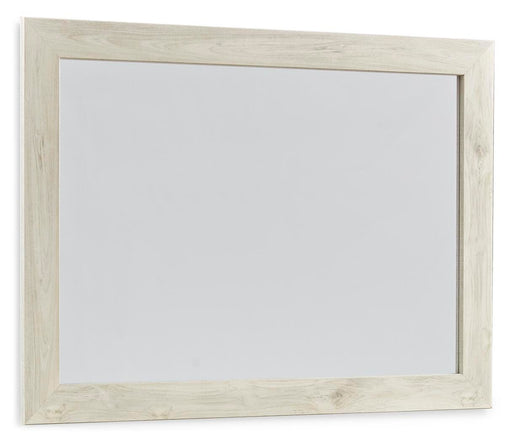 Ashley Furniture Cambeck bedroom mirror with a sleek rectangular design, hanging on a wall with a wooden frame.