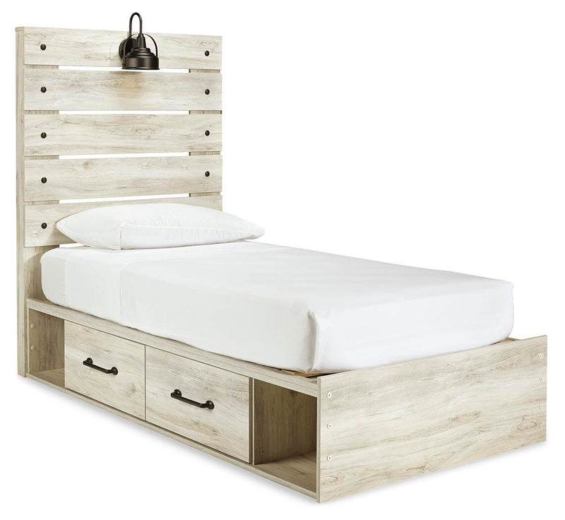 Ashley Furniture Cambeck bed with two storage drawers, showing a stylish wooden bed frame from a side angle.