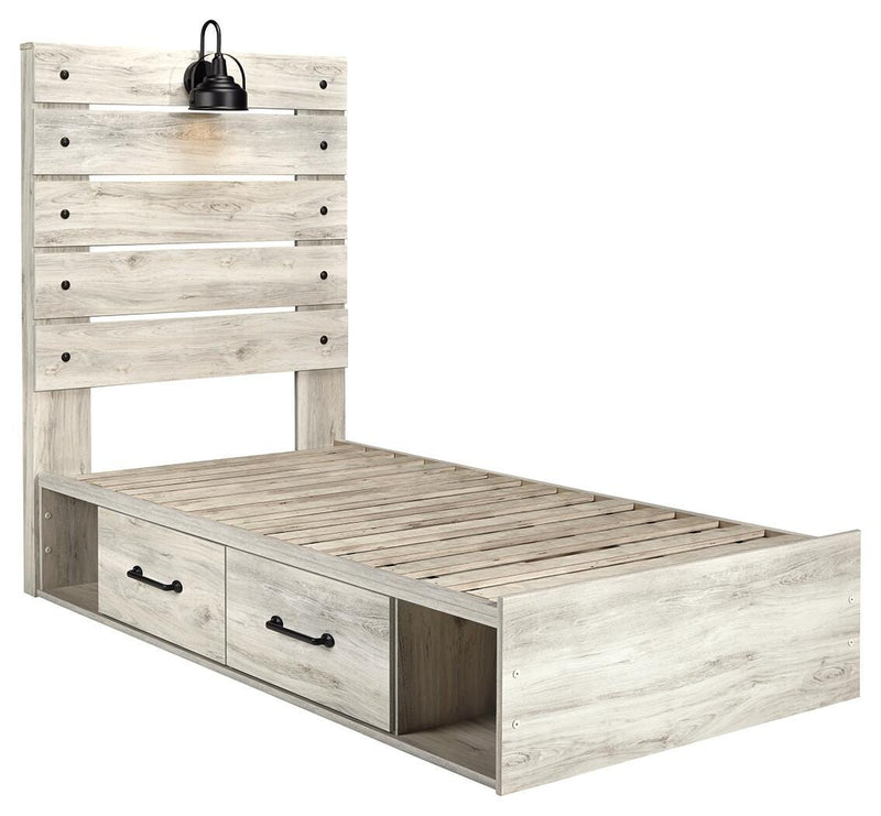 Ashley Furniture Cambeck bed with four storage drawers, featuring a sturdy wooden frame and a modern design in a bedroom setting.