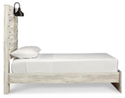 Ashley Furniture Cambeck Bed with a modern design, featuring a sturdy wooden frame and a sleek, dark finish.