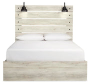 Ashley Furniture Cambeck Bed with a wooden headboard and sleek design, shown from a head-on view.