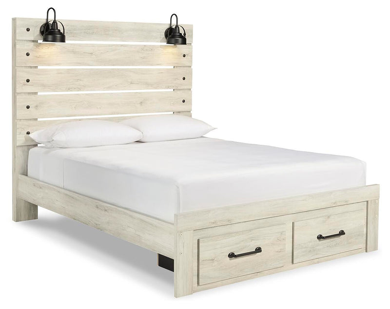 Ashley Furniture Cambeck bed with two built-in storage drawers, shown from an angled side view in a modern bedroom setting.