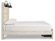 Ashley Furniture Cambeck Bed with two storage drawers, beige fabric upholstery, and a sturdy wooden frame.