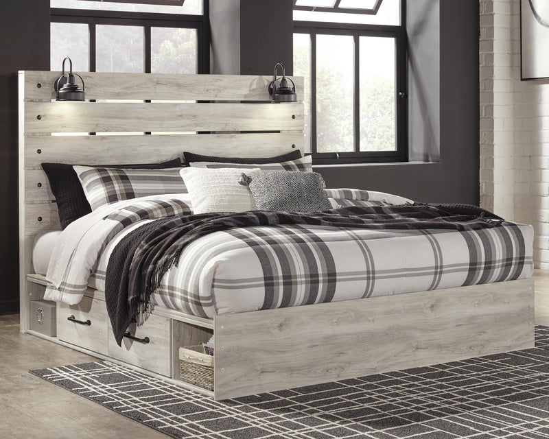 Ashley Furniture Cambeck bed with two storage drawers, featuring a contemporary wood finish and a sturdy frame.