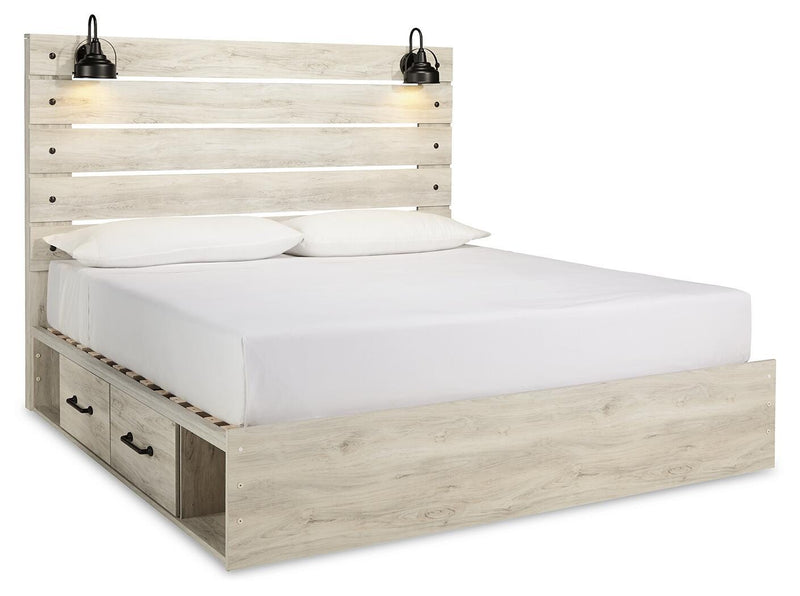 Ashley Furniture Cambeck bed with two storage drawers, featuring a sturdy frame and a stylish design, shown from an angled side view.