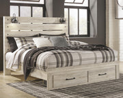 Ashley Furniture Cambeck bed with two built-in storage drawers, showcasing a modern design and sturdy wooden frame.