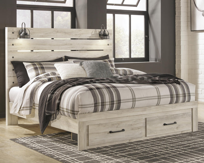 Ashley Furniture Cambeck bed with two built-in storage drawers, showcasing a modern design and sturdy wooden frame.