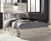 Ashley Furniture Cambeck youth bed with two storage drawers, featuring a sturdy frame and a modern design in a child’s bedroom setting.