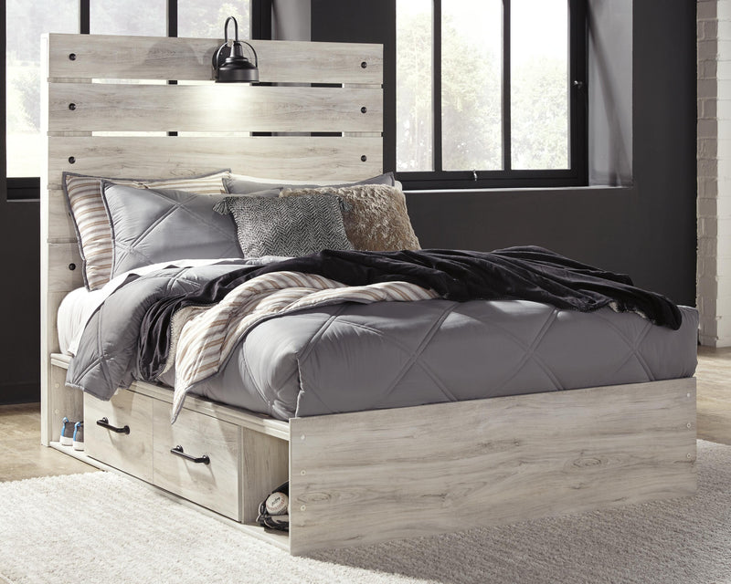 Ashley Furniture Cambeck youth bed with two storage drawers, featuring a sturdy frame and a modern design in a child’s bedroom setting.