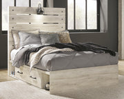 Ashley Furniture Cambeck bed with four built-in storage drawers, featuring a modern design and sturdy wood construction.
