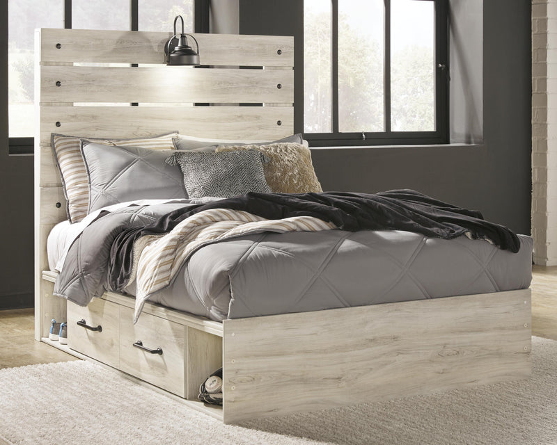 Ashley Furniture Cambeck bed with four built-in storage drawers, featuring a modern design and sturdy wood construction.