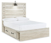 Ashley Furniture Cambeck bed with four storage drawers, shown from an angled side view in a modern bedroom setting.
