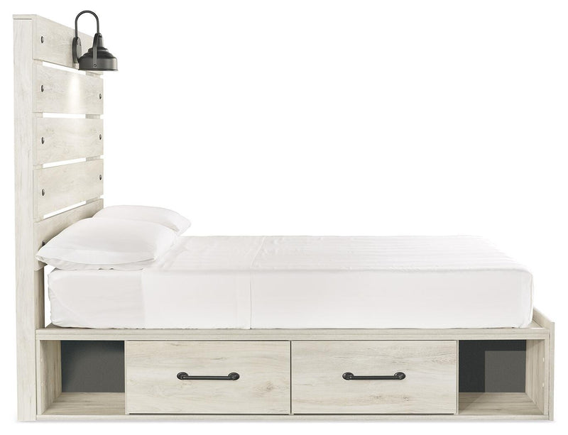 Ashley Furniture Cambeck Bed with four storage drawers, shown in a modern bedroom setting with a dark wood finish.