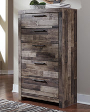Ashley Furniture Derekson chest of drawers, wooden storage chest with multiple drawers, in a modern bedroom setting.