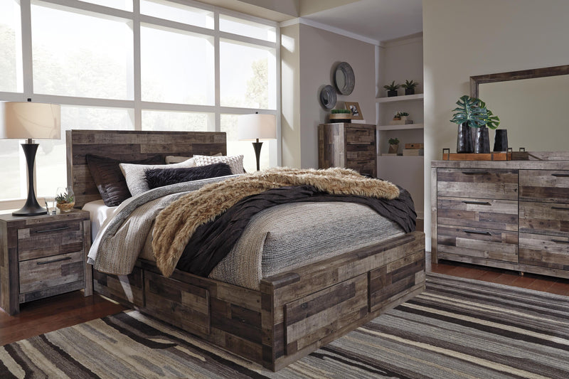 Ashley Furniture Derekson bed with four storage drawers, dark wood finish, and upholstered headboard in a bedroom setting.