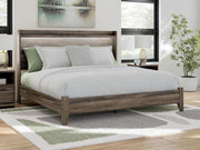Ashley Furniture Elbrim Bed with wooden headboard and frame, showcasing a classic design perfect for a cozy bedroom setting.