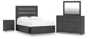 Ashley Furniture Hollivern bedroom set with a bed, dresser, and nightstands in a modern style, shown in a cozy bedroom setting.