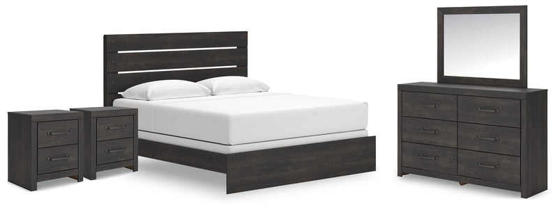 Ashley Furniture Hollivern Bedroom Set featuring a modern bed frame, matching nightstands, and a stylish dresser in a cozy bedroom.