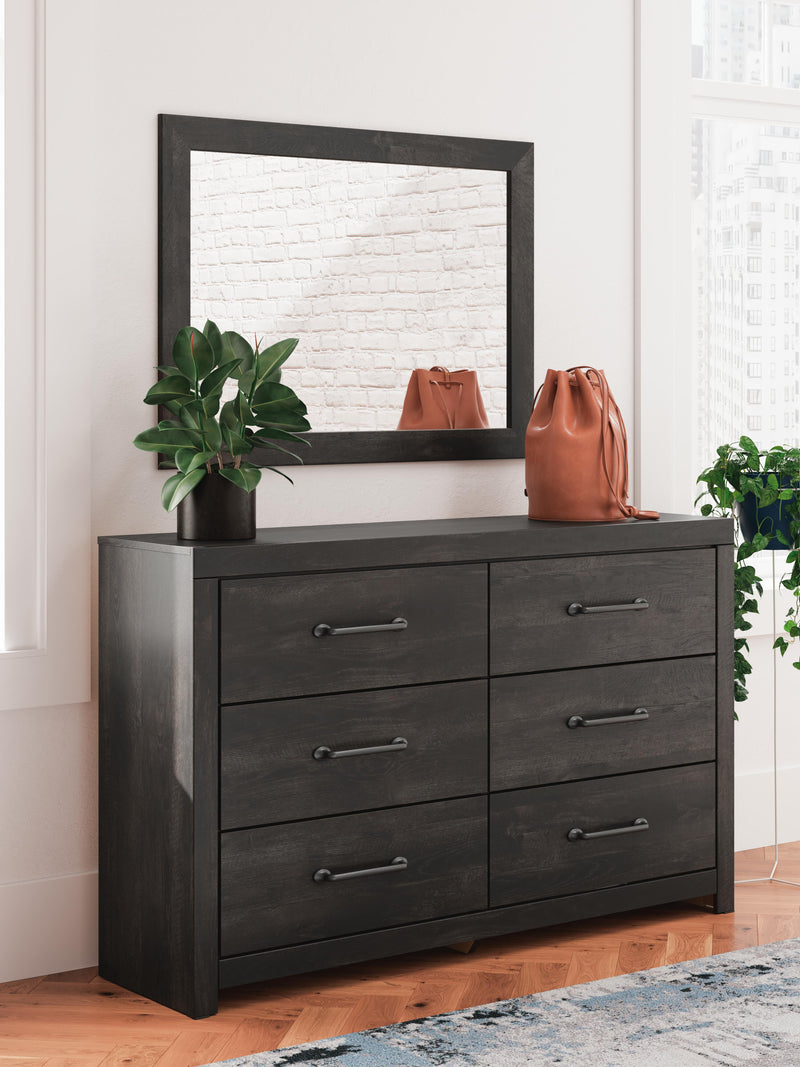 Ashley Furniture Hollivern dresser and mirror set with a wooden finish, featuring multiple drawers and a matching wall mirror.
