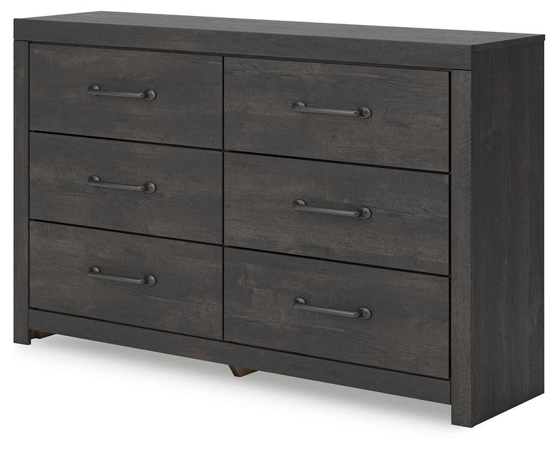 Ashley Furniture Hollivern dresser and mirror set shown from an angled side view, featuring a modern wooden dresser with a matching mirror.