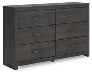 Ashley Furniture Hollivern dresser with matching mirror, featuring a sleek wood finish and modern design, shown from an angle.