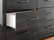 Ashley Furniture Hollivern Dresser with detailed wood finish, featuring multiple drawers and elegant hardware for bedroom storage.
