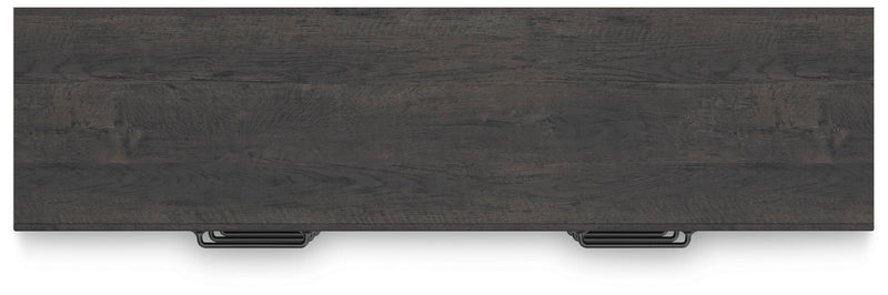 Ashley Furniture Hollivern dresser with a sleek wood finish and modern drawer handles, showing the top view of the dresser.
