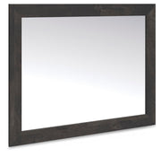Ashley Furniture Hollivern dresser and mirror set, featuring a sleek wood dresser with a matching rectangular mirror, angled view.