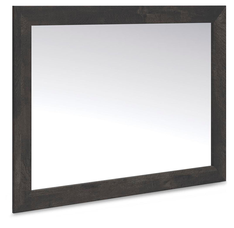 Ashley Furniture Hollivern bedroom mirror, angled view showing a sleek, modern mirror with a wooden frame.