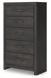 Ashley Furniture Hollivern chest of drawers showing a stylish wooden storage unit with multiple drawers and angled design.