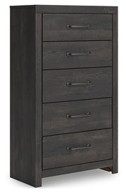 Ashley Furniture Hollivern Chest of Drawers showing angled view of wooden storage cabinet with drawers.