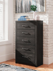 Ashley Furniture Hollivern chest of drawers featuring a stylish wooden finish and multiple spacious drawers.