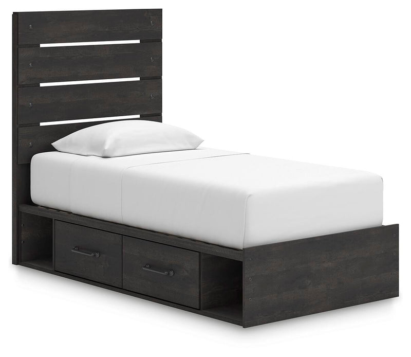 Ashley Furniture Hollivern Bed with a stylish upholstered headboard and wooden frame, shown from an angled side view.