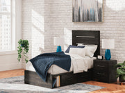 Ashley Furniture Hollivern Bed with a stylish upholstered headboard and neutral-toned bedding in a cozy bedroom setting.