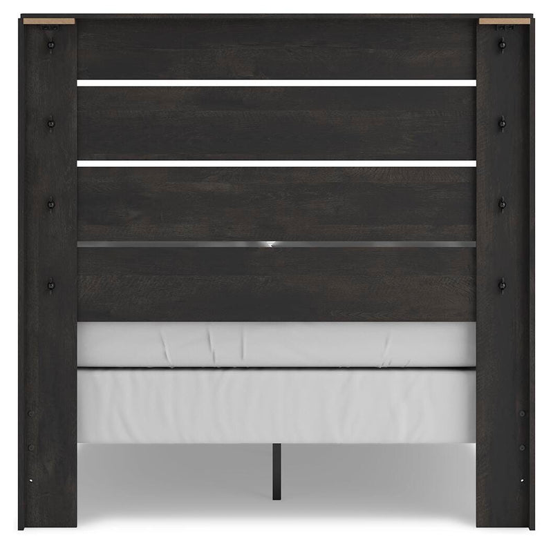 Ashley Furniture Hollivern Bedroom Set featuring a modern bed frame, nightstands, and matching dresser in a stylish bedroom layout.