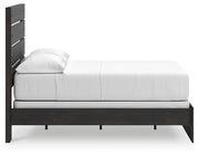 Ashley Furniture Hollivern bedroom set featuring a bed frame, nightstands, and dresser in a stylish bedroom scene.