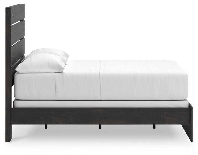 Ashley Furniture Hollivern bedroom set featuring a bed frame, nightstands, and dresser in a stylish bedroom scene.