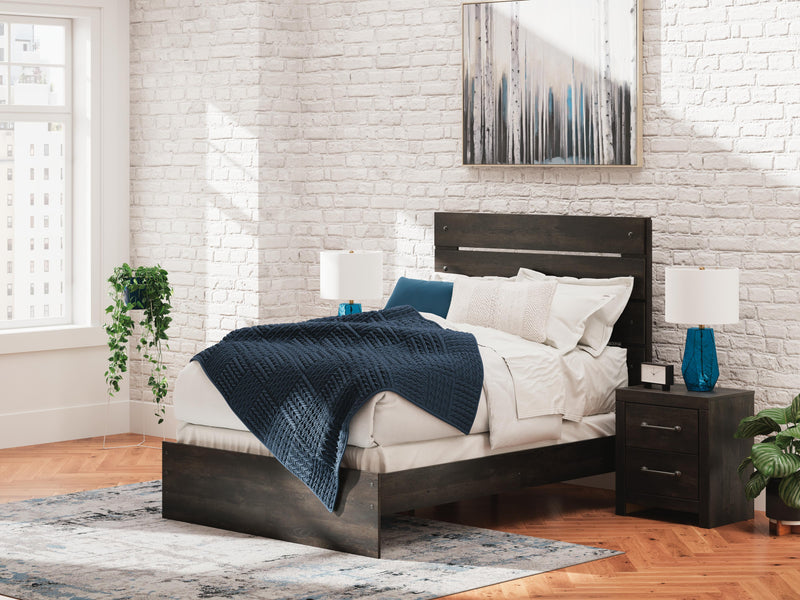 Ashley Furniture Hollivern bedroom set featuring a bed frame, nightstands, and dresser in a modern design.
